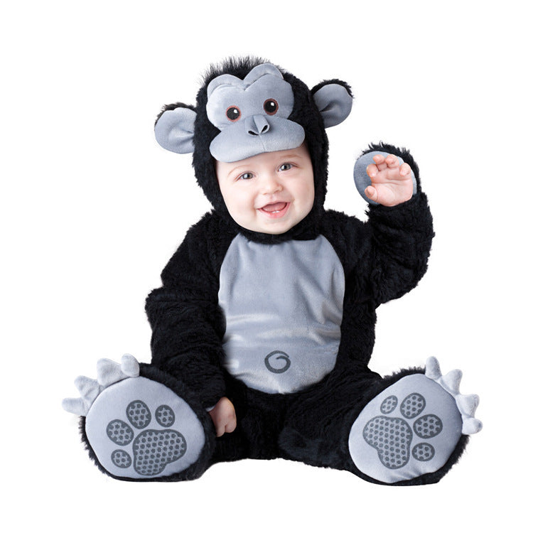 Baby in a monkey costume with black, gray, and white colors on a white background